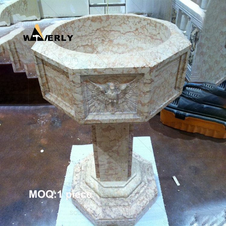 Angels surround the marble baptismal basin -40907