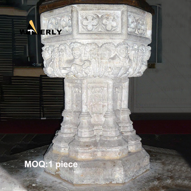 Angels surround the marble baptismal basin -40907