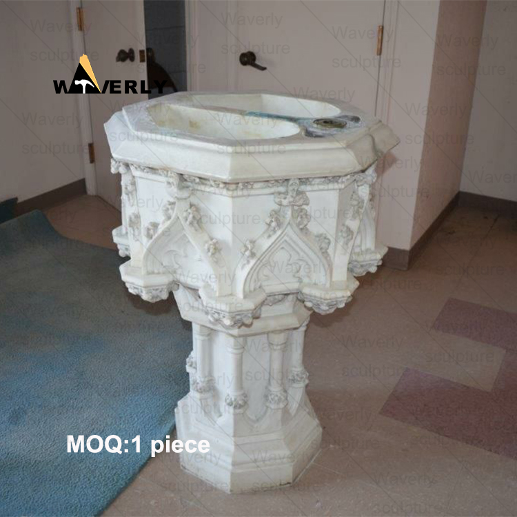 Angels surround the marble baptismal basin -40907