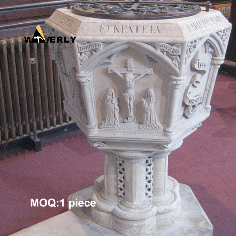 Angels surround the marble baptismal basin -40907